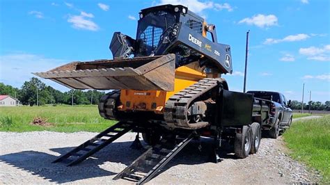 can you pull a skid steer into dump truck|skid steer with dump trailer.